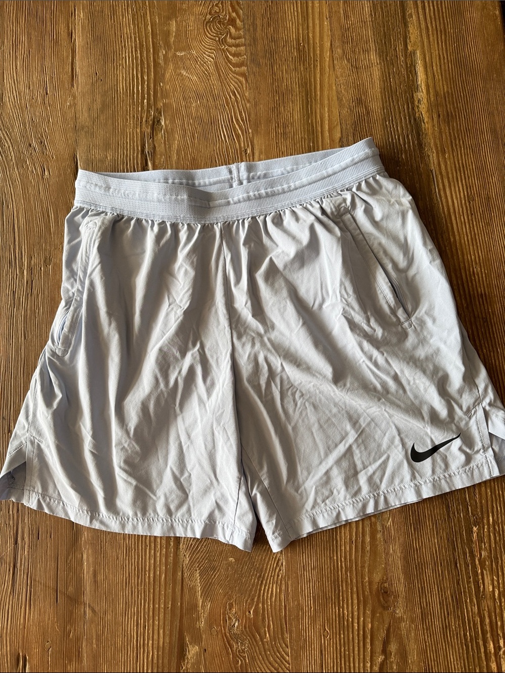 Nike Women's Light Blue Athletic Shorts with Black Swoosh
